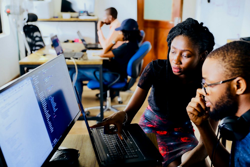 Diverse California digital users and product team interacting with software on desktop